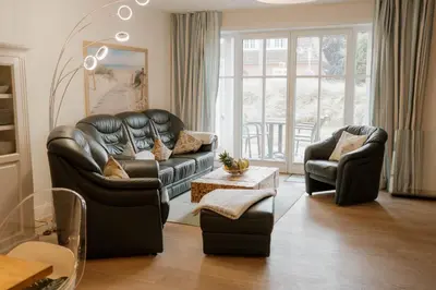 Ein Sitzbereich in der Unterkunft Büsumer Reethus Apartment 1 1
