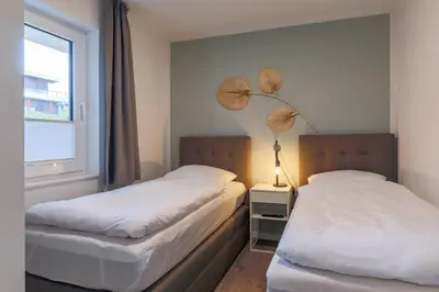 Ein Bett oder Betten in einem Zimmer der Unterkunft Haus Treibholz Apartment 6