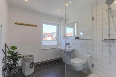 Ein Badezimmer in der Unterkunft Haus Treibholz Apartment 8