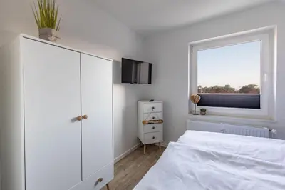 Ein Bett oder Betten in einem Zimmer der Unterkunft Haus Treibholz Apartment 9