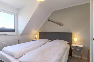 Ein Bett oder Betten in einem Zimmer der Unterkunft Haus Treibholz Apartment 9