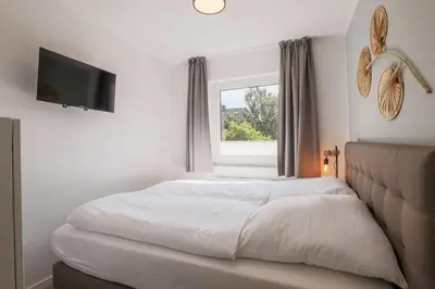 Ein Bett oder Betten in einem Zimmer der Unterkunft Haus Treibholz Apartment 7