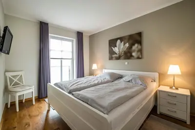 Ein Bett oder Betten in einem Zimmer der Unterkunft Haus Hafenresidenz Apartment 2 2