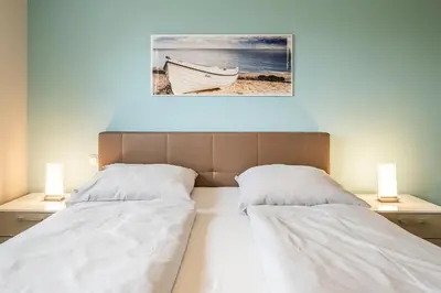 Ein Bett oder Betten in einem Zimmer der Unterkunft Haus Deichoase Apartment 1 5