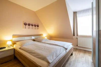 Ein Bett oder Betten in einem Zimmer der Unterkunft Haus Kähler 2 Wohnung 11