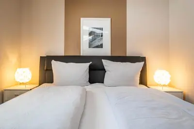 Ein Bett oder Betten in einem Zimmer der Unterkunft Haus Seemeile Wohnung 2 3