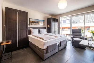 Ein Bett oder Betten in einem Zimmer der Unterkunft Haus Seemeile Wohnung 2 10