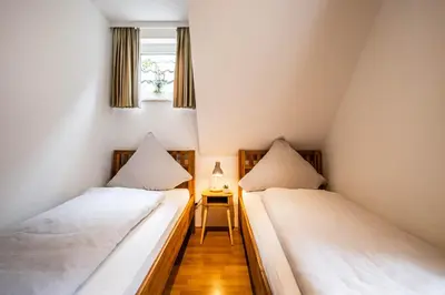 Ein Bett oder Betten in einem Zimmer der Unterkunft Haus Seemeile Wohnung 2 16