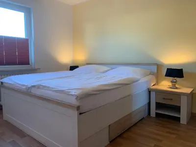 Ein Bett oder Betten in einem Zimmer der Unterkunft Kleine Brise Apartment 1
