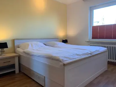 Ein Bett oder Betten in einem Zimmer der Unterkunft Kleine Brise Apartment 3