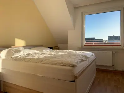 Ein Bett oder Betten in einem Zimmer der Unterkunft Kleine Brise Apartment 8