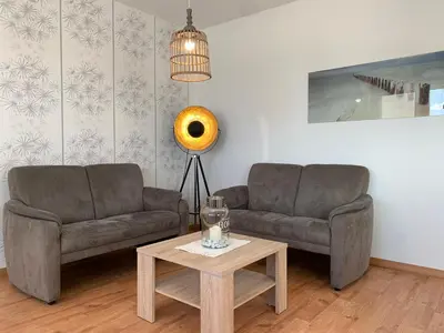 Ein Sitzbereich in der Unterkunft Kleine Brise Apartment 9