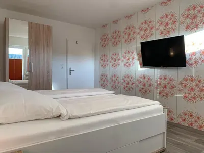Ein Bett oder Betten in einem Zimmer der Unterkunft Kleine Brise Apartment 11 Bootsmann Stuuv