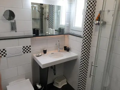 Ein Badezimmer in der Unterkunft Strandstraße 51a FeWo Kaptäns Suite
