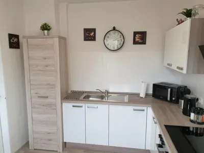 Küche/Küchenzeile in der Unterkunft Strandstraße 51a FeWo Kaptäns Suite