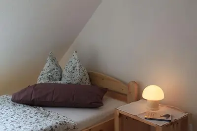 Ein Bett oder Betten in einem Zimmer der Unterkunft Ferienhof Schoof No2