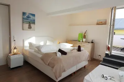 Ein Bett oder Betten in einem Zimmer der Unterkunft Haus Westerstraße Westerstr 16 Wohnung 2