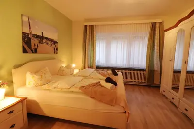 Ein Bett oder Betten in einem Zimmer der Unterkunft Haus Westerstraße Westerstr 16 Wohnung 3