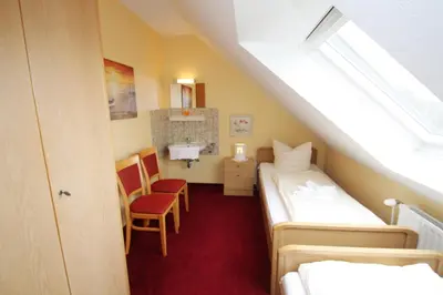 Ein Bett oder Betten in einem Zimmer der Unterkunft Haus Övern Diek Wohnung 4
