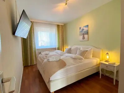 Ein Bett oder Betten in einem Zimmer der Unterkunft Haus Övern Diek Wohnung 5