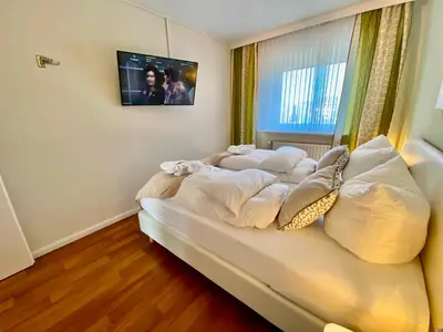 Ein Bett oder Betten in einem Zimmer der Unterkunft Haus Övern Diek Wohnung 5