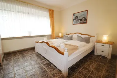 Ein Bett oder Betten in einem Zimmer der Unterkunft Haus Övern Diek Wohnung 8