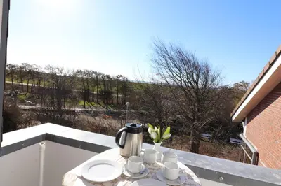 Ein Balkon oder eine Terrasse in der Unterkunft Haus am Kurpark Wohnung 26