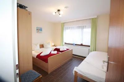 Ein Bett oder Betten in einem Zimmer der Unterkunft Haus am Kurpark Wohnung 1