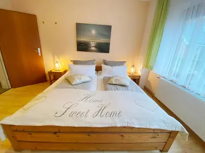 Ein Bett oder Betten in einem Zimmer der Unterkunft Haus am Kurpark Wohnung 4