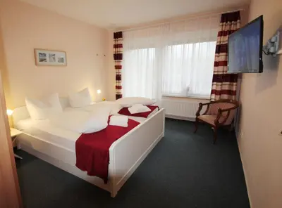 Ein Bett oder Betten in einem Zimmer der Unterkunft Haus am Kurpark Wohnung 7