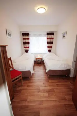 Ein Bett oder Betten in einem Zimmer der Unterkunft Haus am Kurpark Wohnung 7
