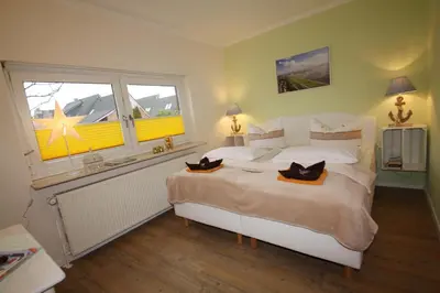 Ein Bett oder Betten in einem Zimmer der Unterkunft Am Oland 13 hinten