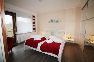 Ein Bett oder Betten in einem Zimmer der Unterkunft Haus am Kurpark Wohnung 14