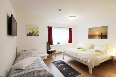 Ein Bett oder Betten in einem Zimmer der Unterkunft Haus am Kurpark Wohnung 18