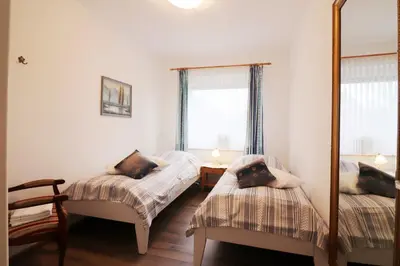 Ein Bett oder Betten in einem Zimmer der Unterkunft Haus am Kurpark Wohnung 18