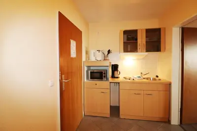 Küche/Küchenzeile in der Unterkunft Haus am Kurpark Wohnung 23