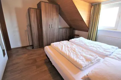 Ein Bett oder Betten in einem Zimmer der Unterkunft Residenz Am Grooten Steen