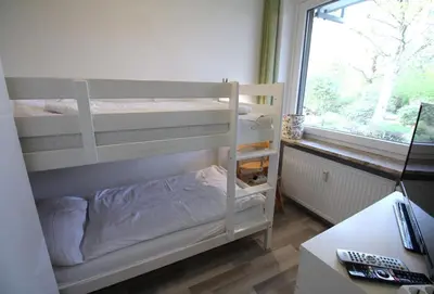 Ein Bett oder Betten in einem Zimmer der Unterkunft Residenz Haus Essen