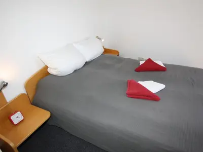 Ein Bett oder Betten in einem Zimmer der Unterkunft Residenz Kormoran 1 3