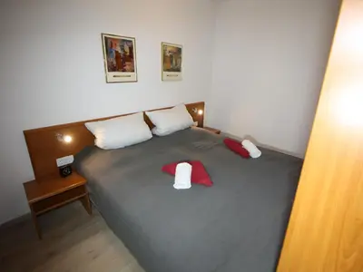 Ein Bett oder Betten in einem Zimmer der Unterkunft Residenz Kormoran 1 4