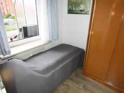 Ein Bett oder Betten in einem Zimmer der Unterkunft Residenz Kormoran 1 4