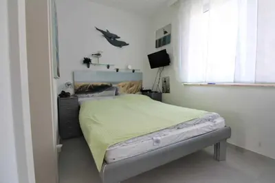 Ein Bett oder Betten in einem Zimmer der Unterkunft Residenz Thalassa
