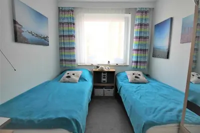 Ein Bett oder Betten in einem Zimmer der Unterkunft Residenz Thalassa
