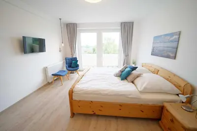 Ein Bett oder Betten in einem Zimmer der Unterkunft Residenz Nordfeldstraße - direkt am Deich