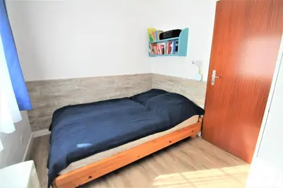 Ein Bett oder Betten in einem Zimmer der Unterkunft Residenz Vogelsand 2