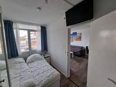 Ein Bett oder Betten in einem Zimmer der Unterkunft Frische Brise FeWo 02.09