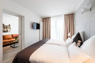 Ein Bett oder Betten in einem Zimmer der Unterkunft Weisse Villa Apartment 1 4 Buhne 48