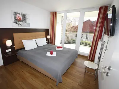 Ein Bett oder Betten in einem Zimmer der Unterkunft HP Touristik - Residenz Hohe Lith Neu 3 1 1