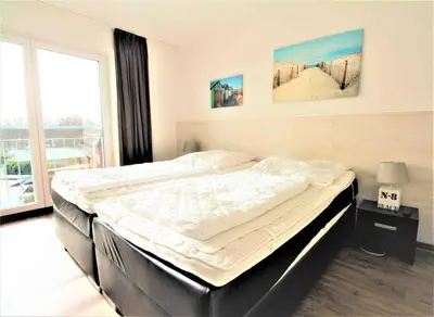 Ein Bett oder Betten in einem Zimmer der Unterkunft HP Touristik - Residenz Hohe Lith Neu 4 1
