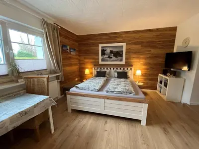 Ein Bett oder Betten in einem Zimmer der Unterkunft Appartement 1 mit Küche und neuem Bad, frisch saniert